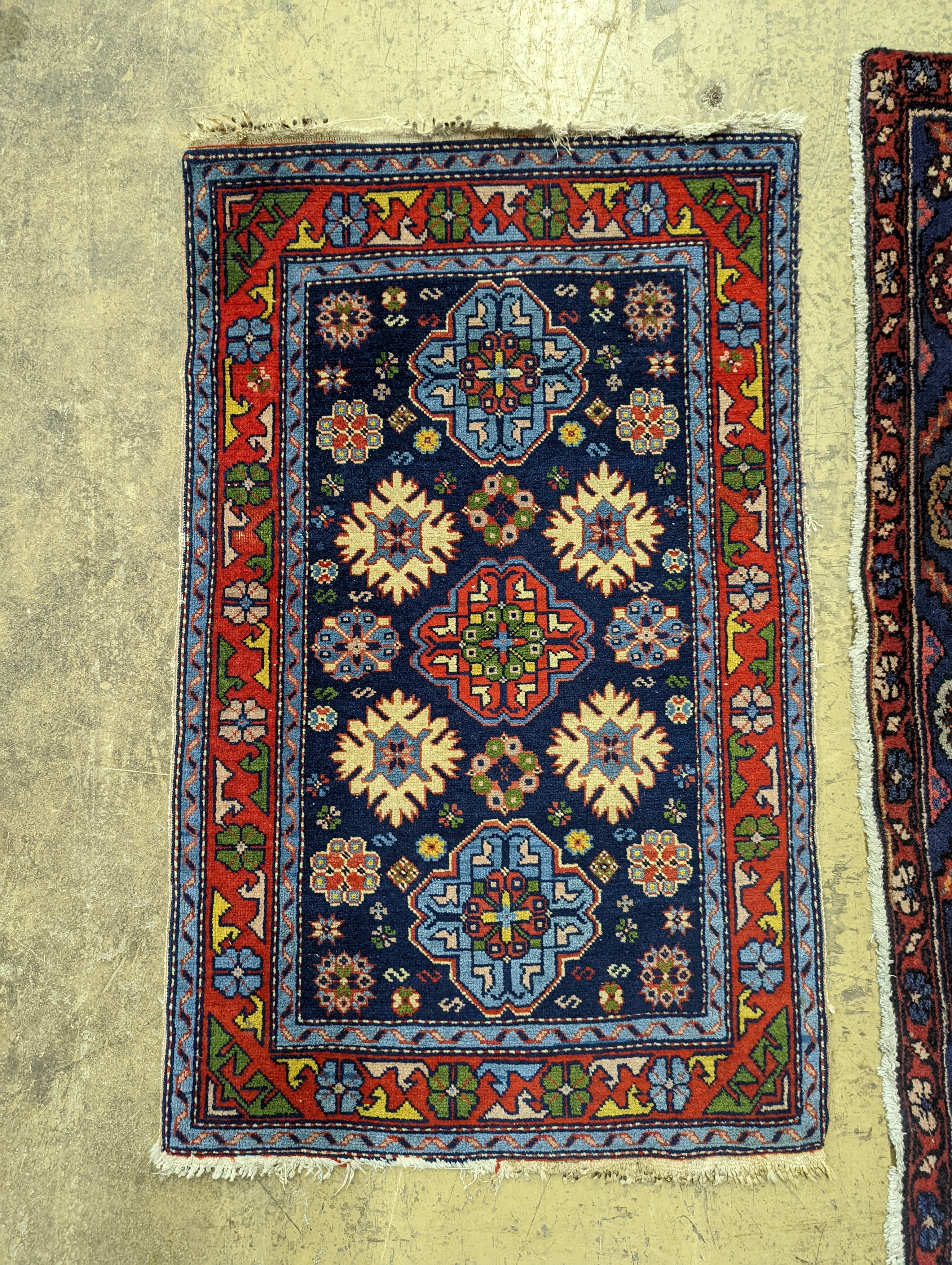 A Hamadan blue ground floral rug and a smaller Caucasian design blue ground rug, larger 210 x 130cm
